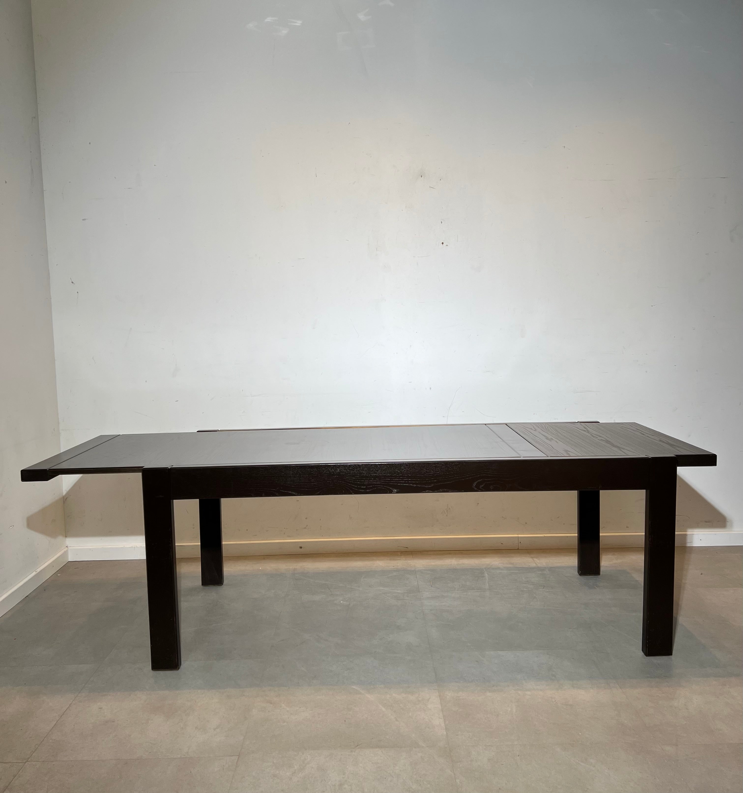 Extendable dark oak dining table with 6 rush chairs