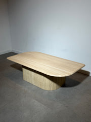 Table basse en travertin avec piètement central arrondi