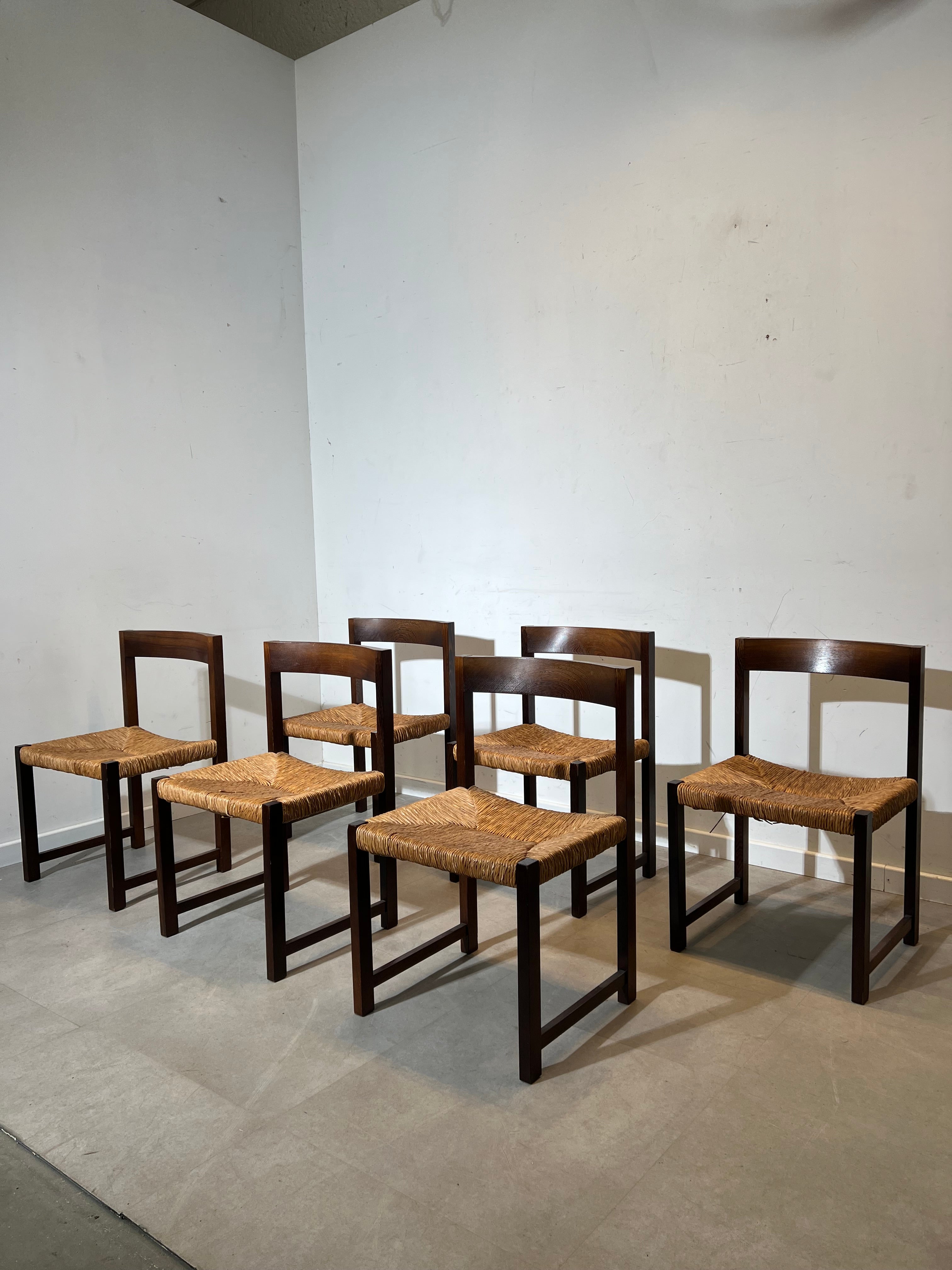 Extendable dark oak dining table with 6 rush chairs