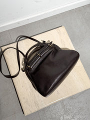 Delvaux “Mango” schoudertas – donkerbruin leer