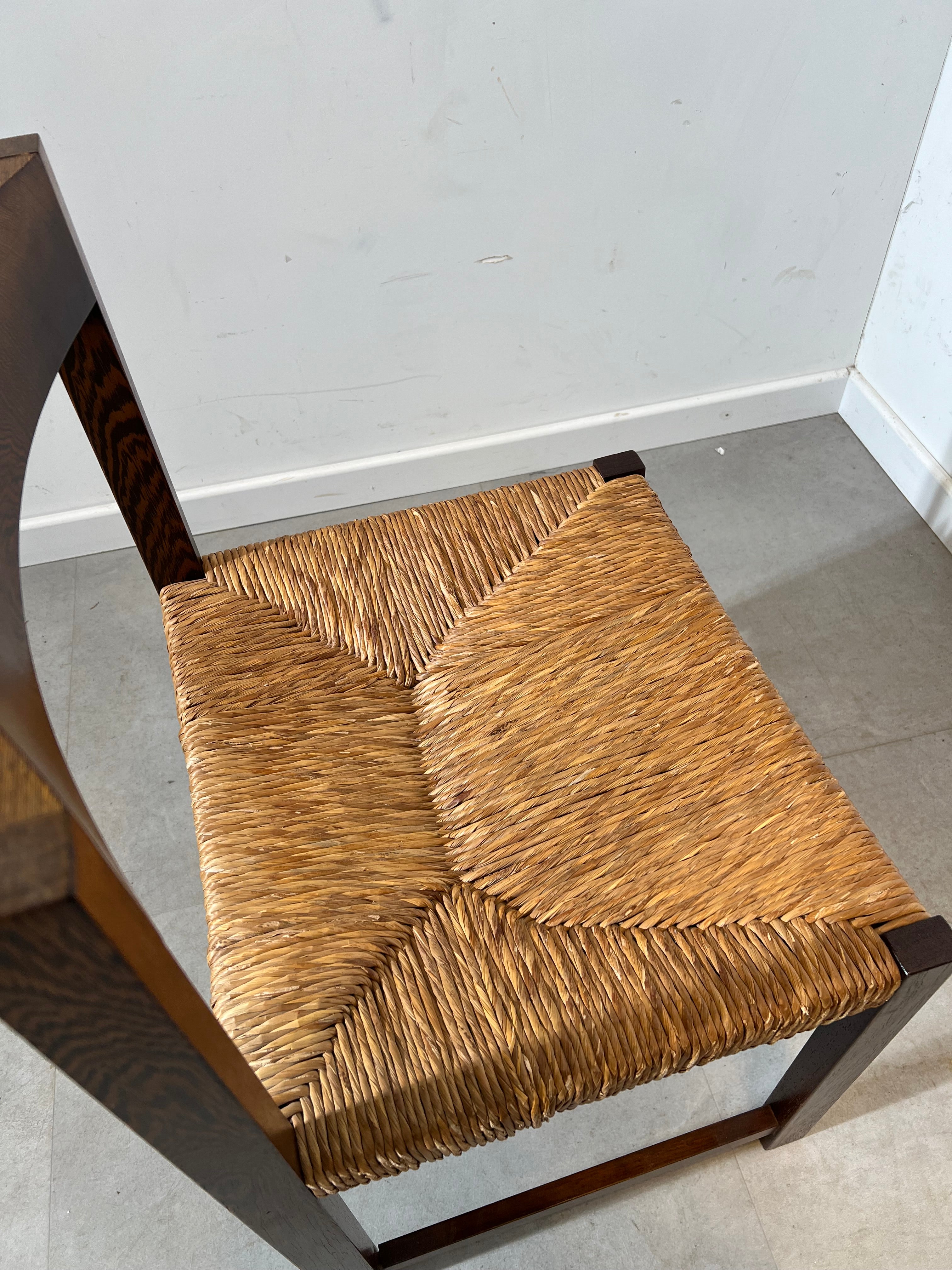 Extendable dark oak dining table with 6 rush chairs