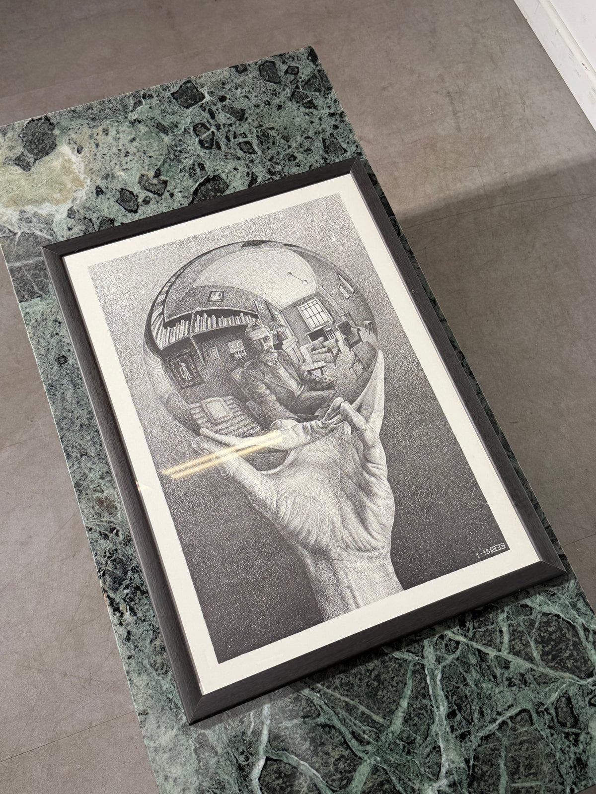M. C. Escher “Hand with Reflecting Sphere” – Framed Print, 45 × 62 cm