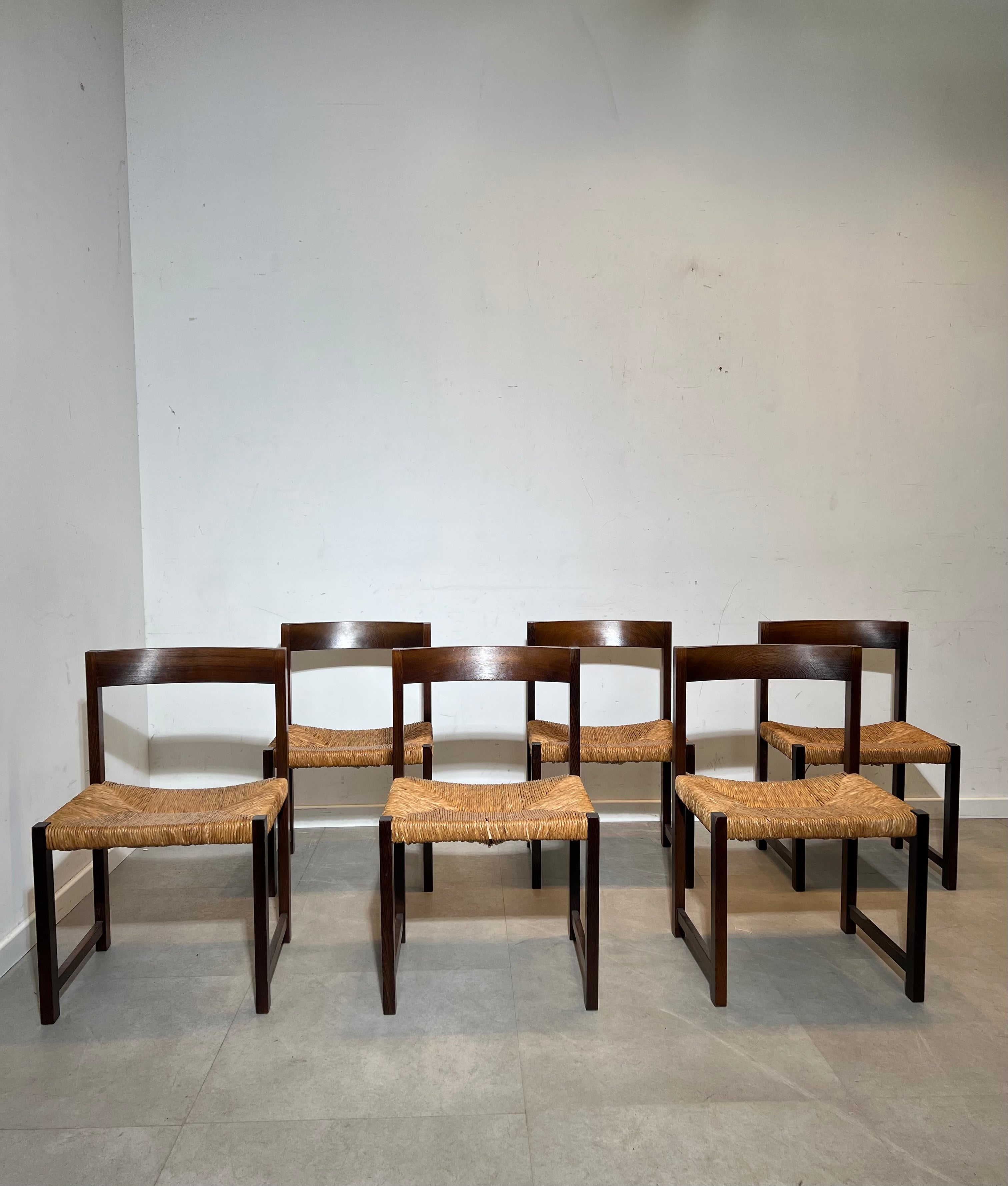 Extendable dark oak dining table with 6 rush chairs