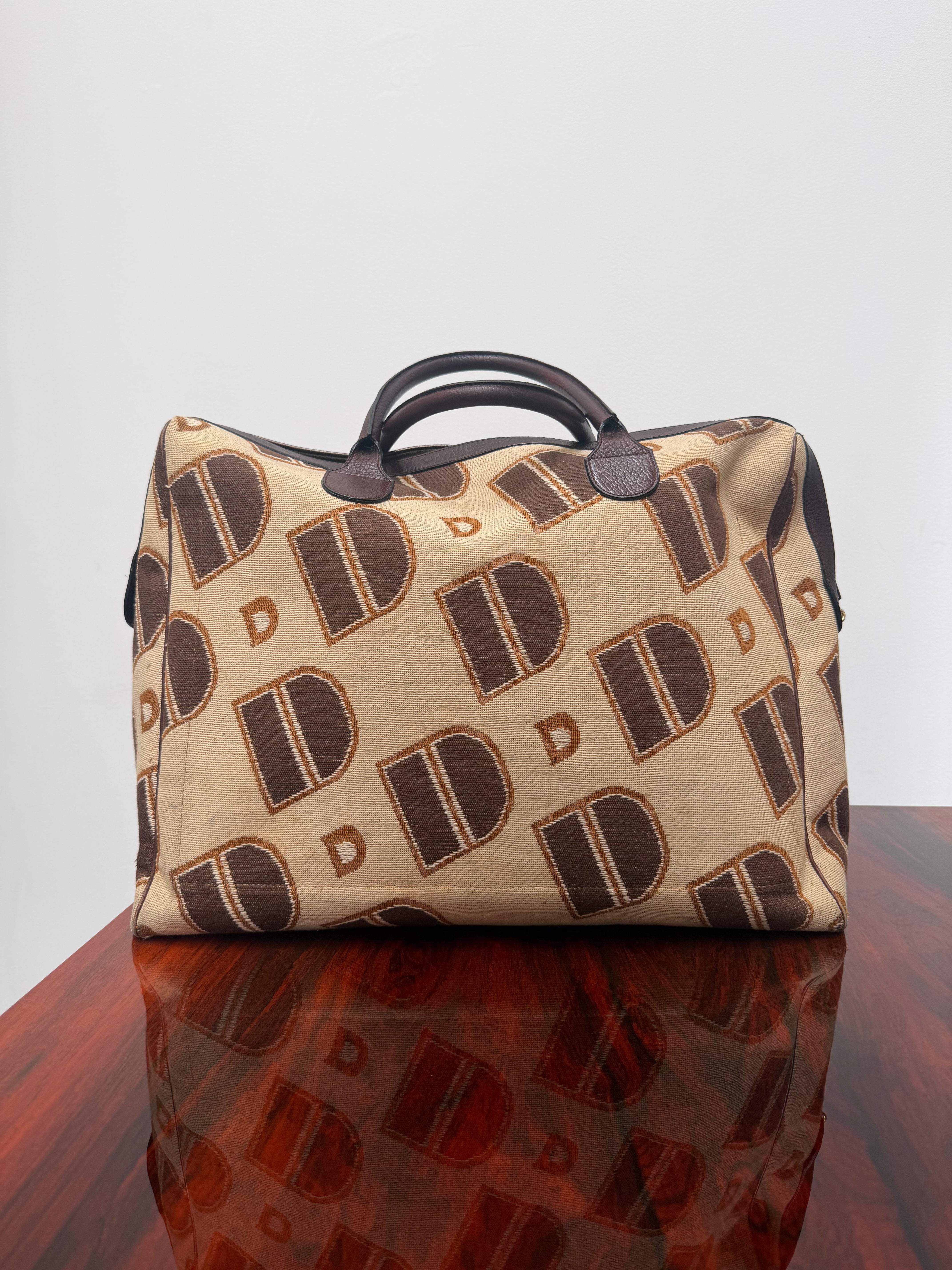 Delvaux 1973 Monogram Canvas Travel Bag – Top Handle