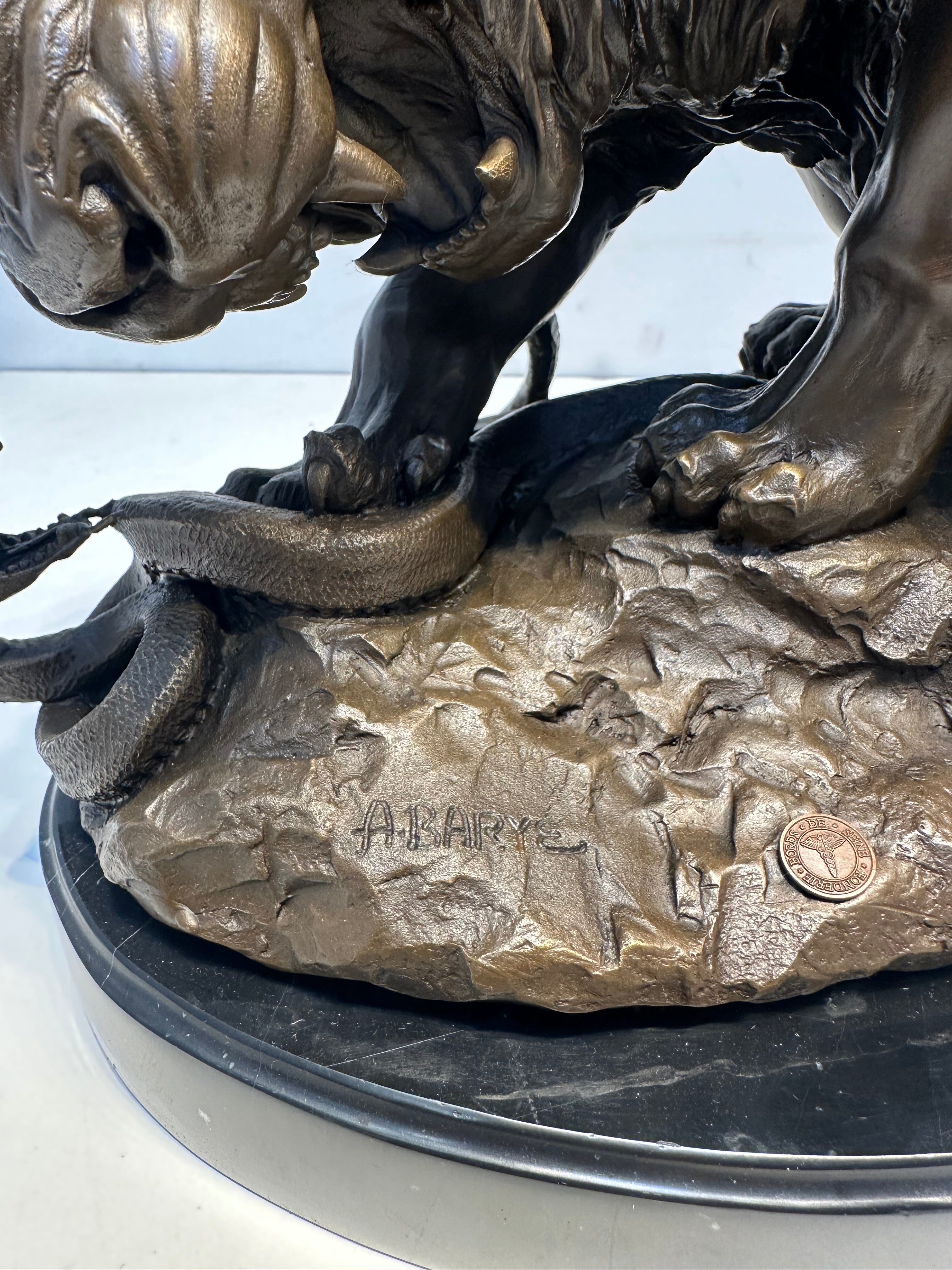 Bronze Sculpture “Lion Attacking a Snake” Signed