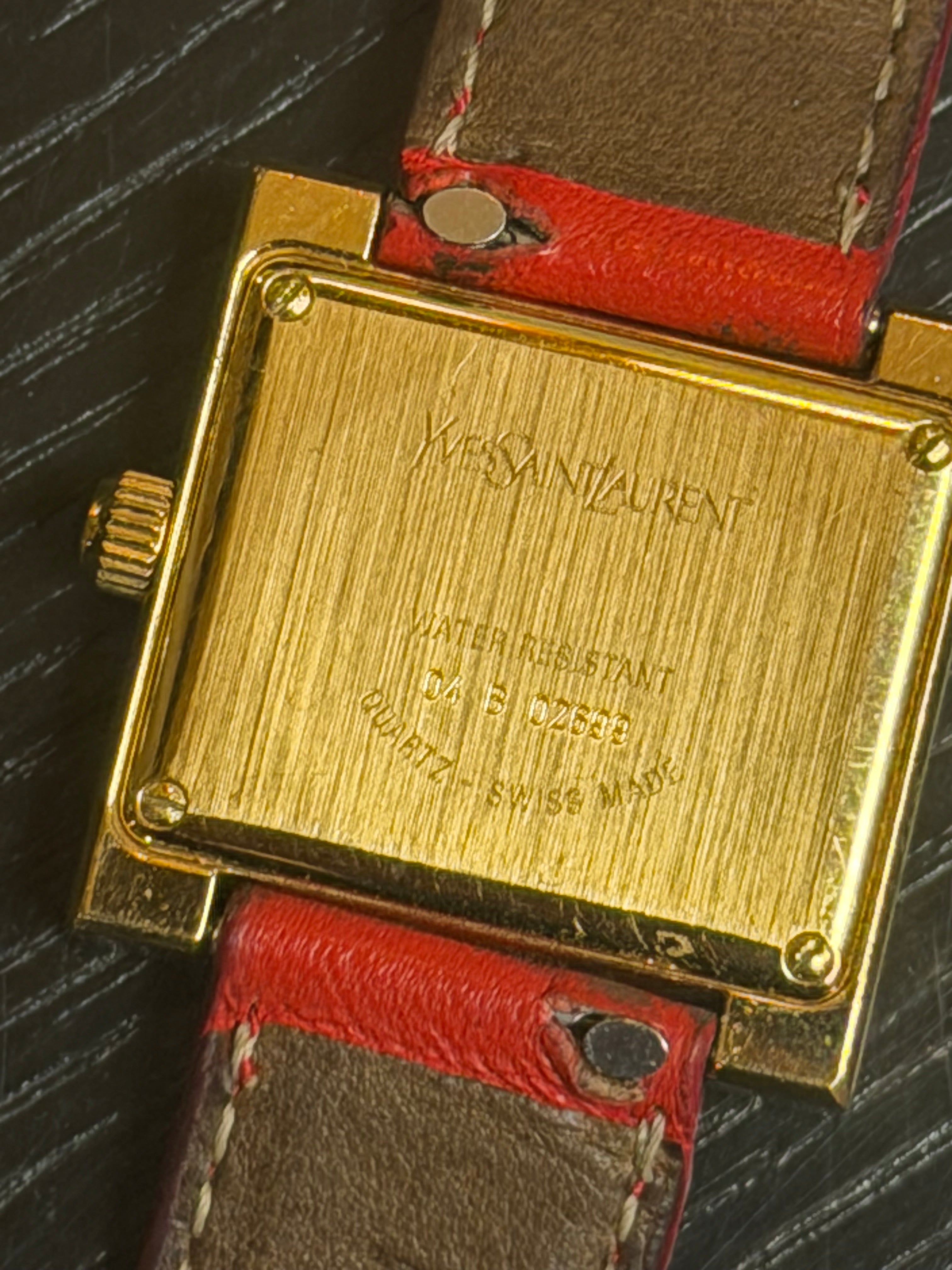 Vintage Yves Saint Laurent Quartz Watch – Gold Tone Case, Red Leather Strap – Swiss Made