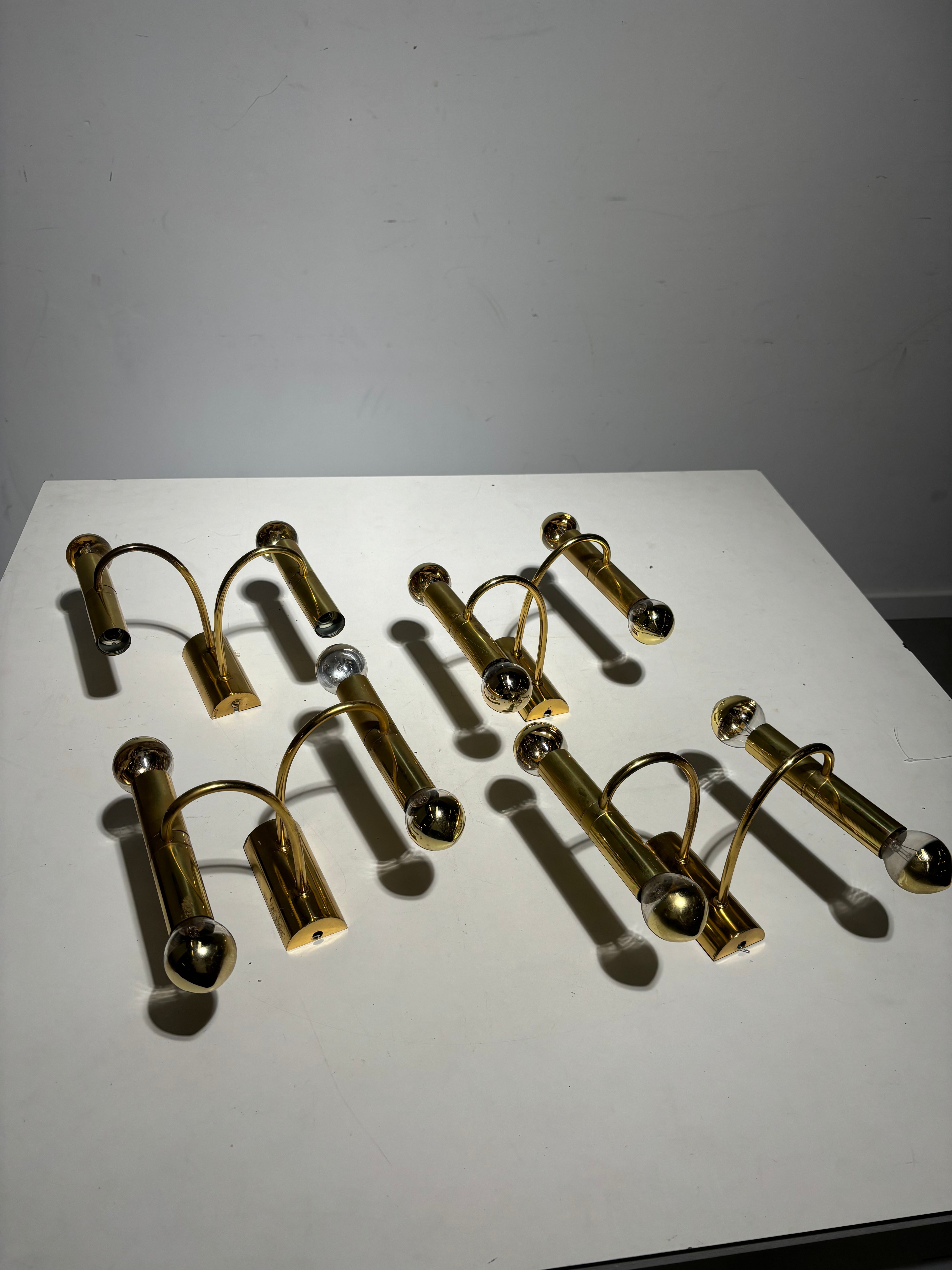 Set of four brass wall sconces