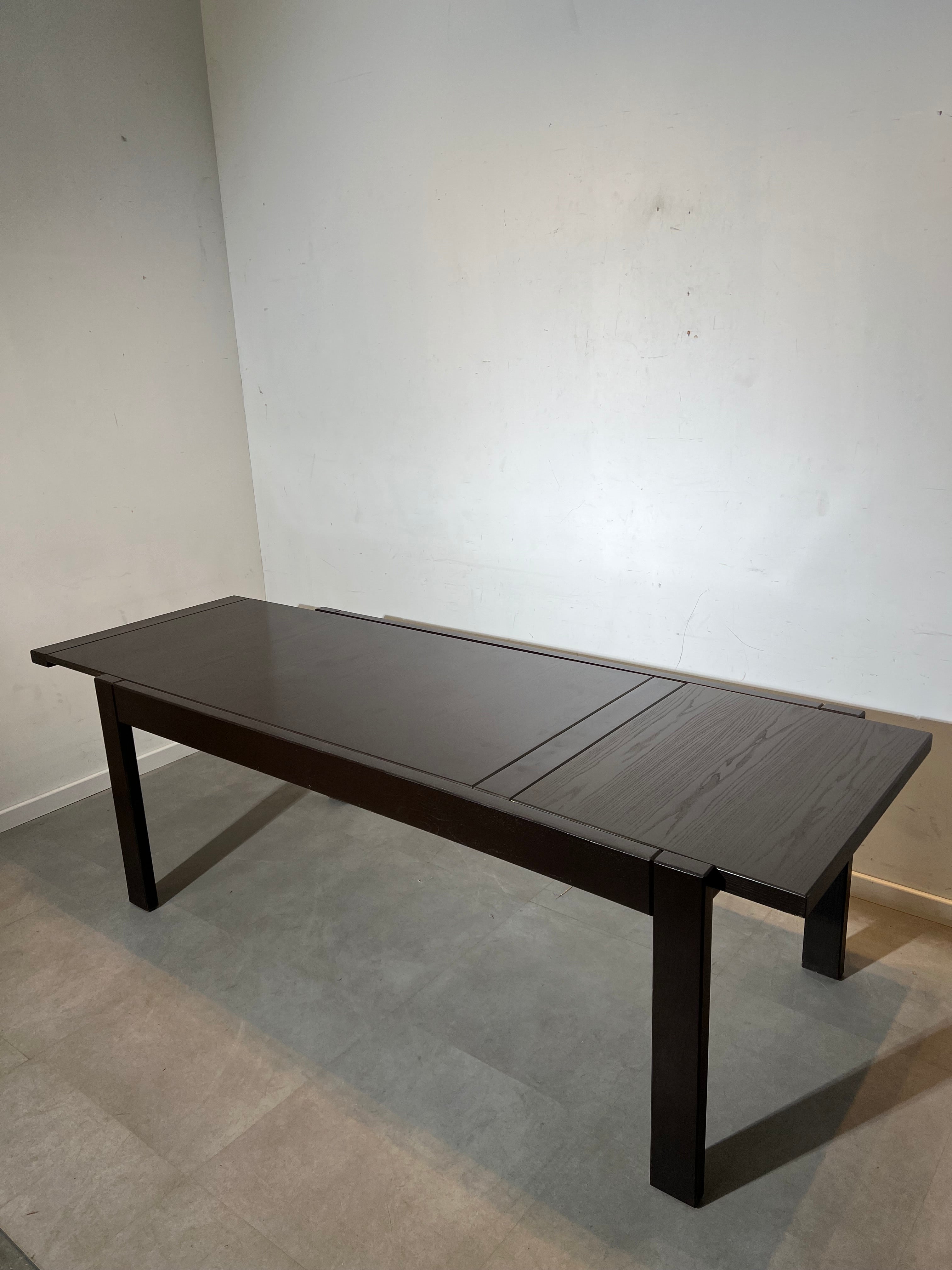 Extendable dark oak dining table with 6 rush chairs