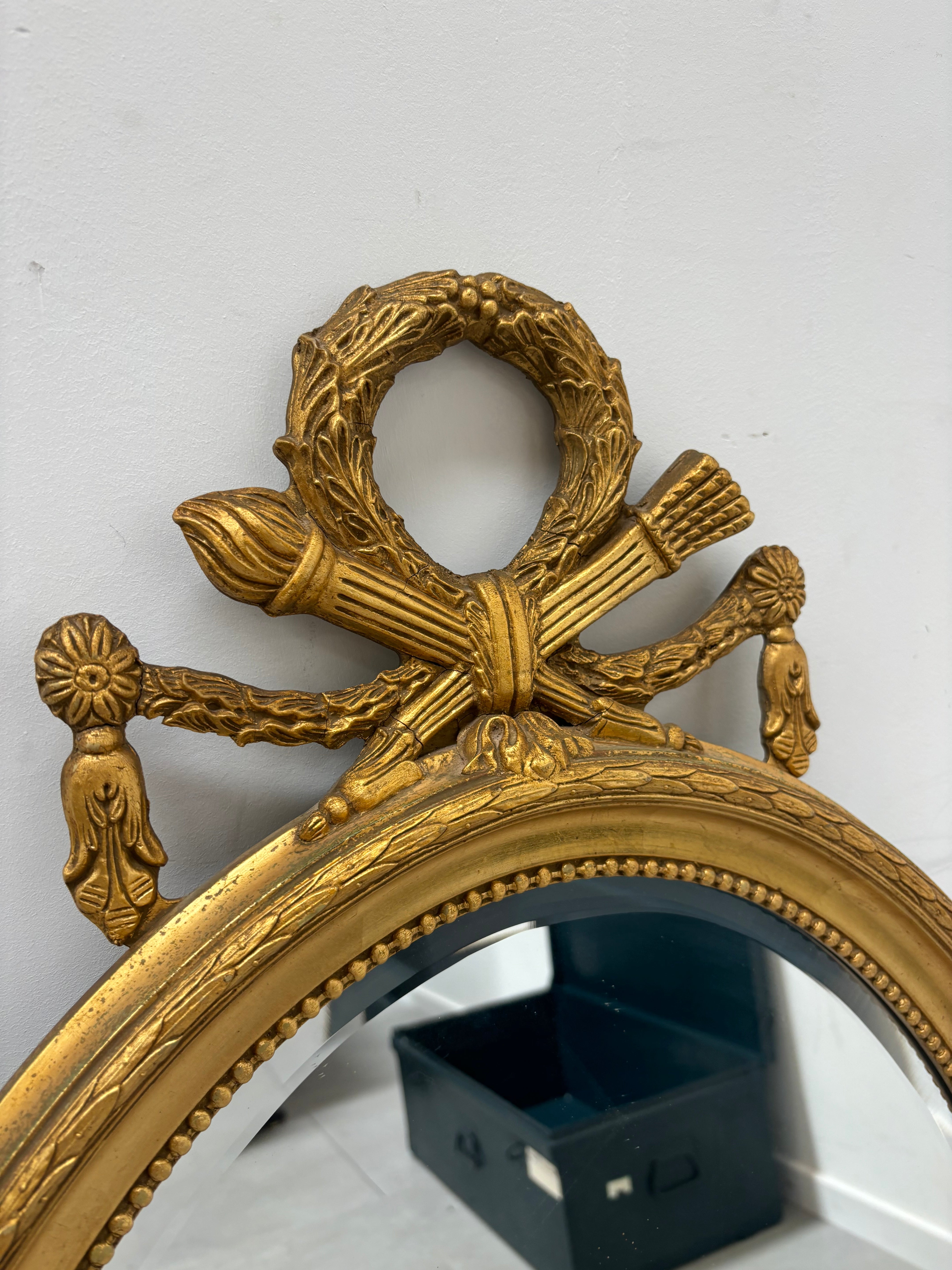 Antique oval gold cut mirror