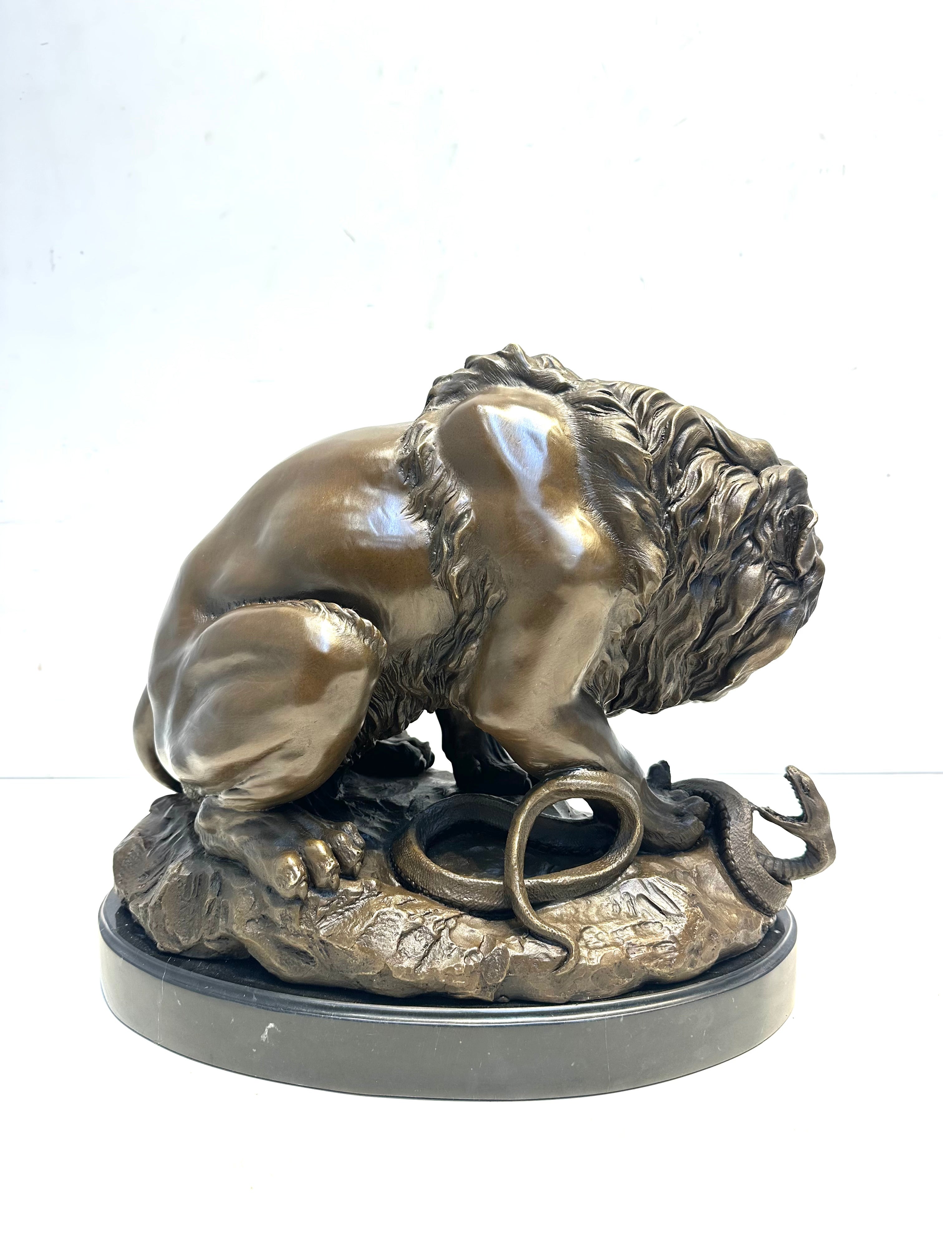 Bronze Sculpture “Lion Attacking a Snake” Signed