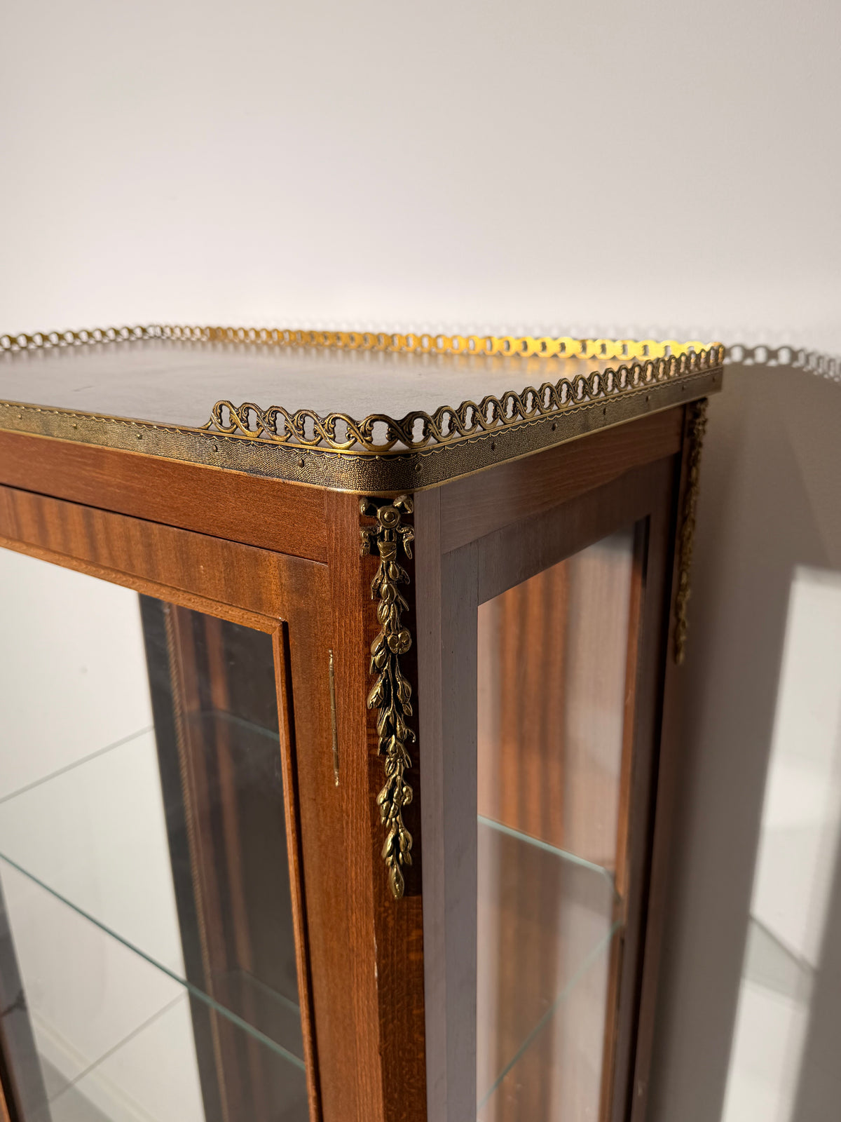 Louis XVI Style Glass Display Cabinet with Decorative Metal Mounts