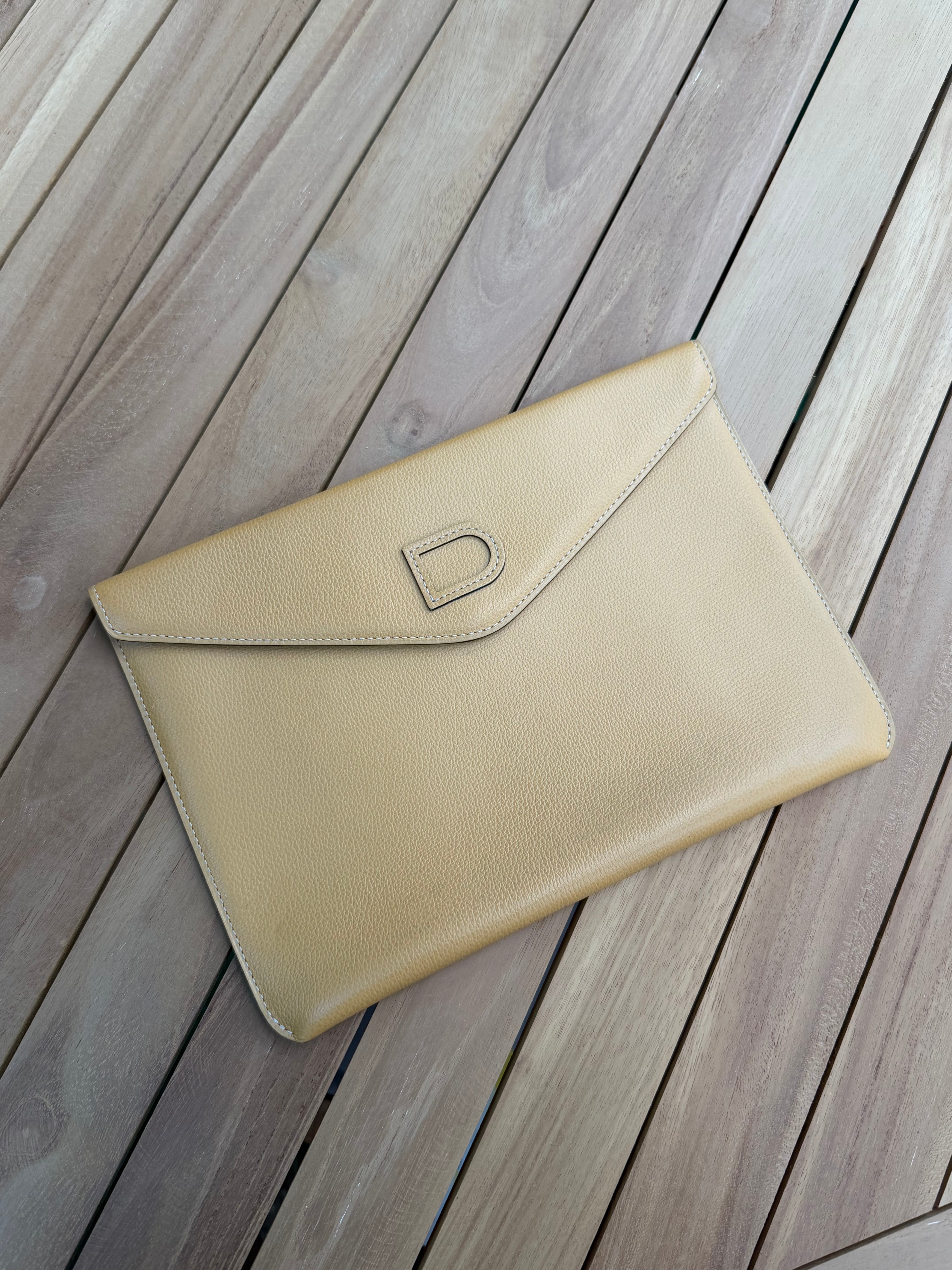 Delvaux “Fusée” Clutch – Cognac Leather