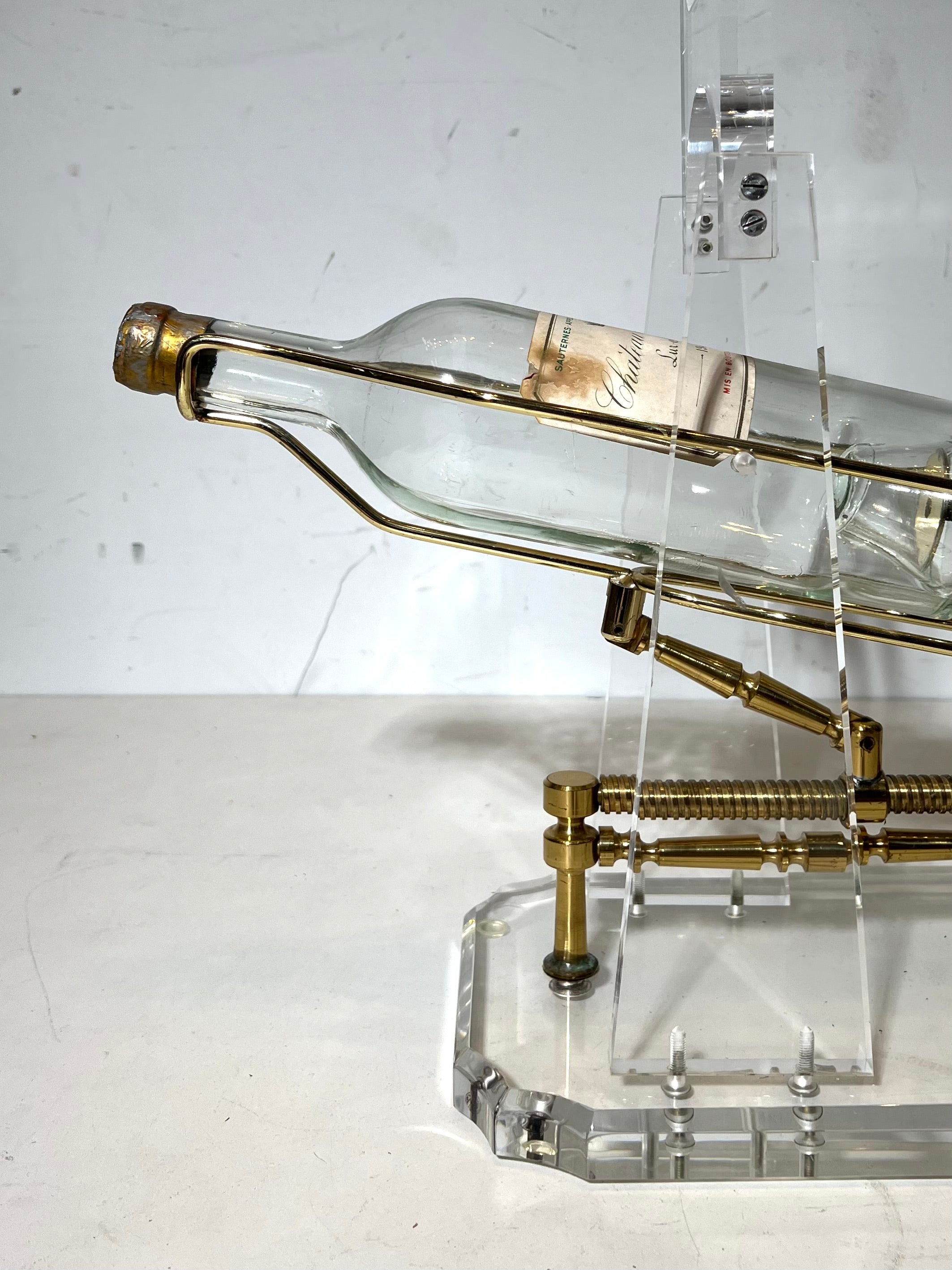 Vintage Lucite & Brass Mechanical Wine Bottle Display Stand