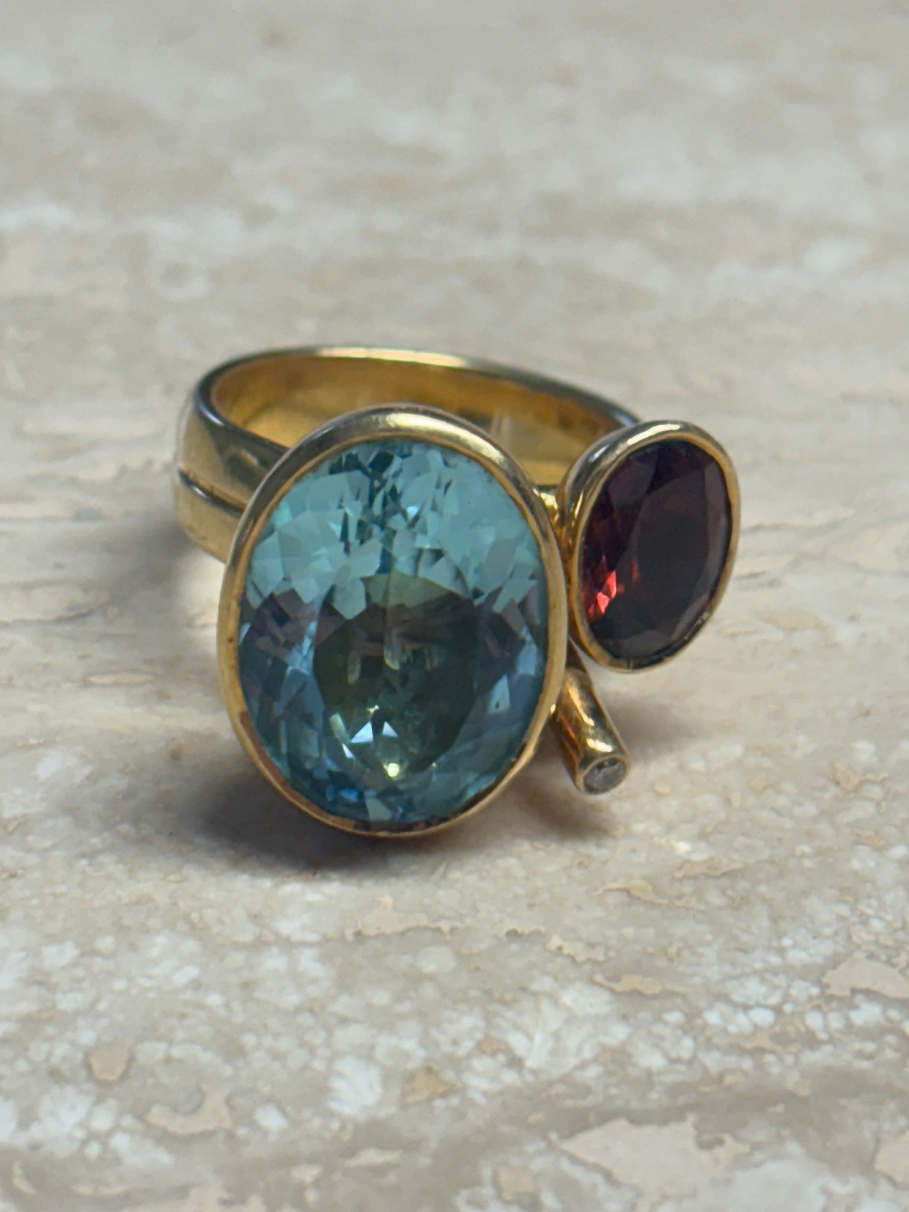 18 kt Gold Ring with Blue Topaz, Garnet & Diamond Accent – Size 55