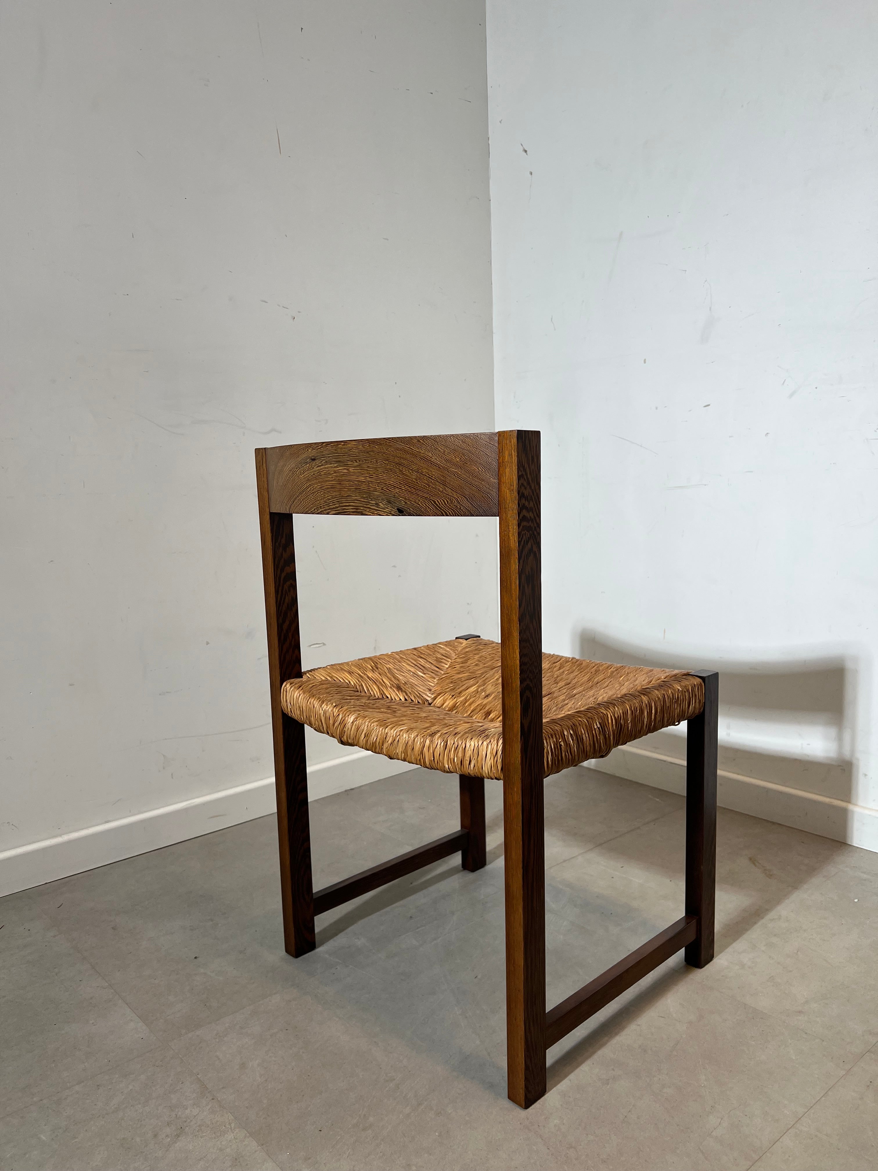 Extendable dark oak dining table with 6 rush chairs